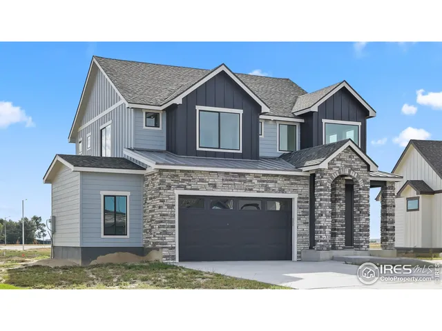 a front view of a house with a garage