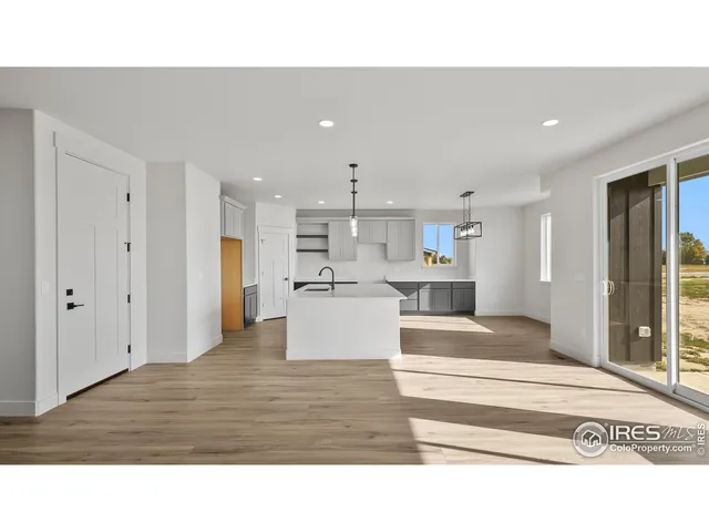 a open kitchen with kitchen island a sink window and stainless steel appliances