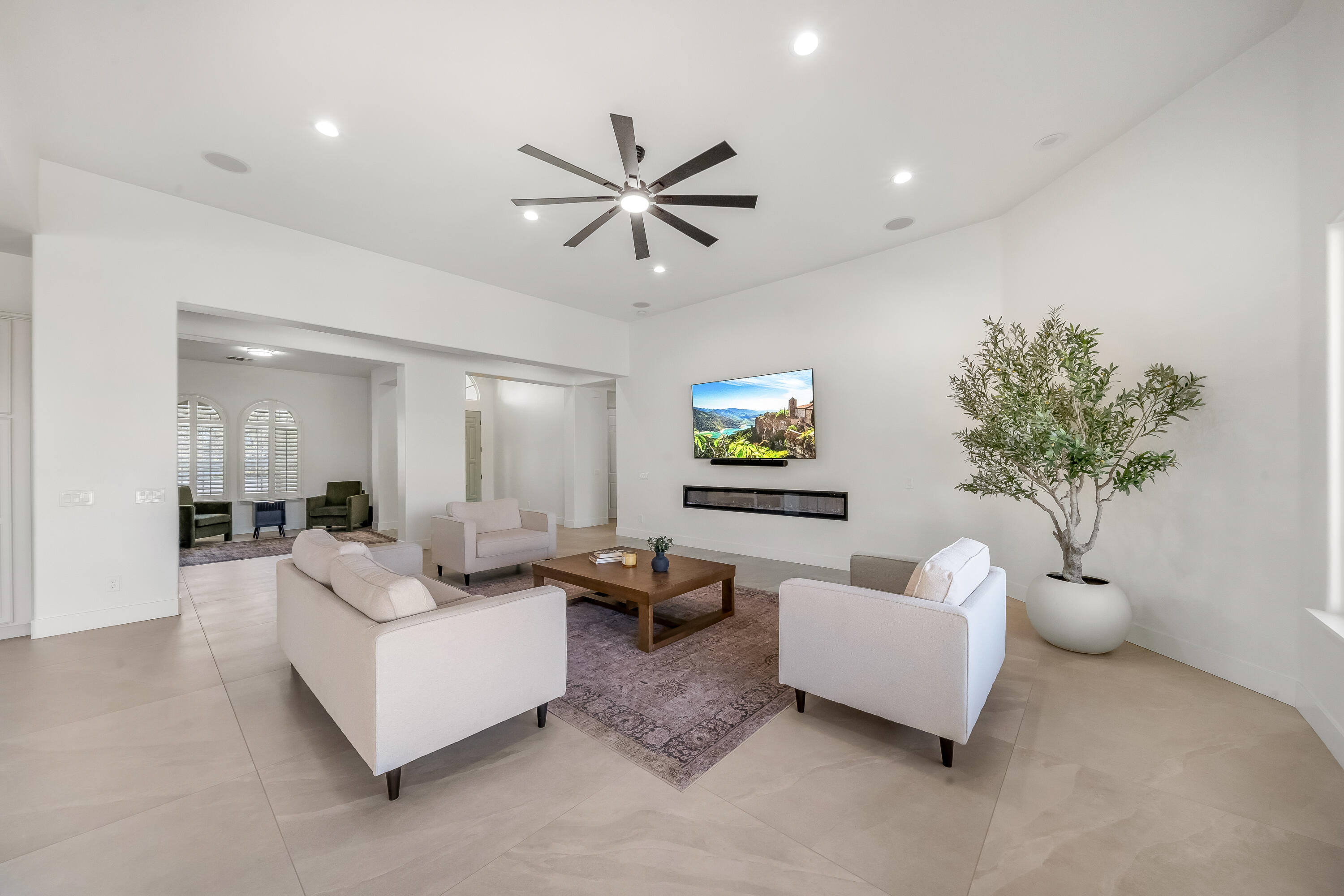 80262 Amazon Avenue Indio, CA 92201 - Photo 23 of 69 a living room with furniture and a potted plant