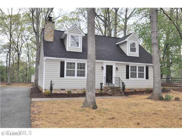 7261 Strawberry Road Summerfield, NC 27358 - Photo 2 of 13 Exterior Front. New roof and new wrought iron front porch railings and reseeded front yard will make the curb appeal really shine!