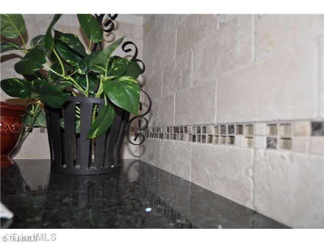 7261 Strawberry Road Summerfield, NC 27358 - Photo 5 of 13 Kitchen. New tile backsplash is a great compliment!