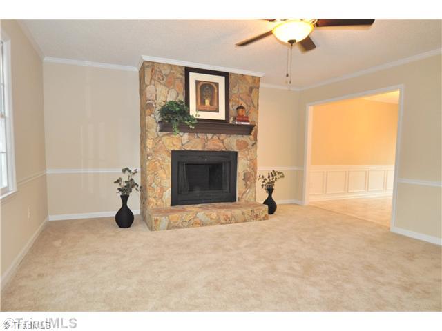7261 Strawberry Road Summerfield, NC 27358 - Photo 6 of 13 Den/Family/Great Room. Spacious Great Room is accented by a stone, wood-burning fireplace.