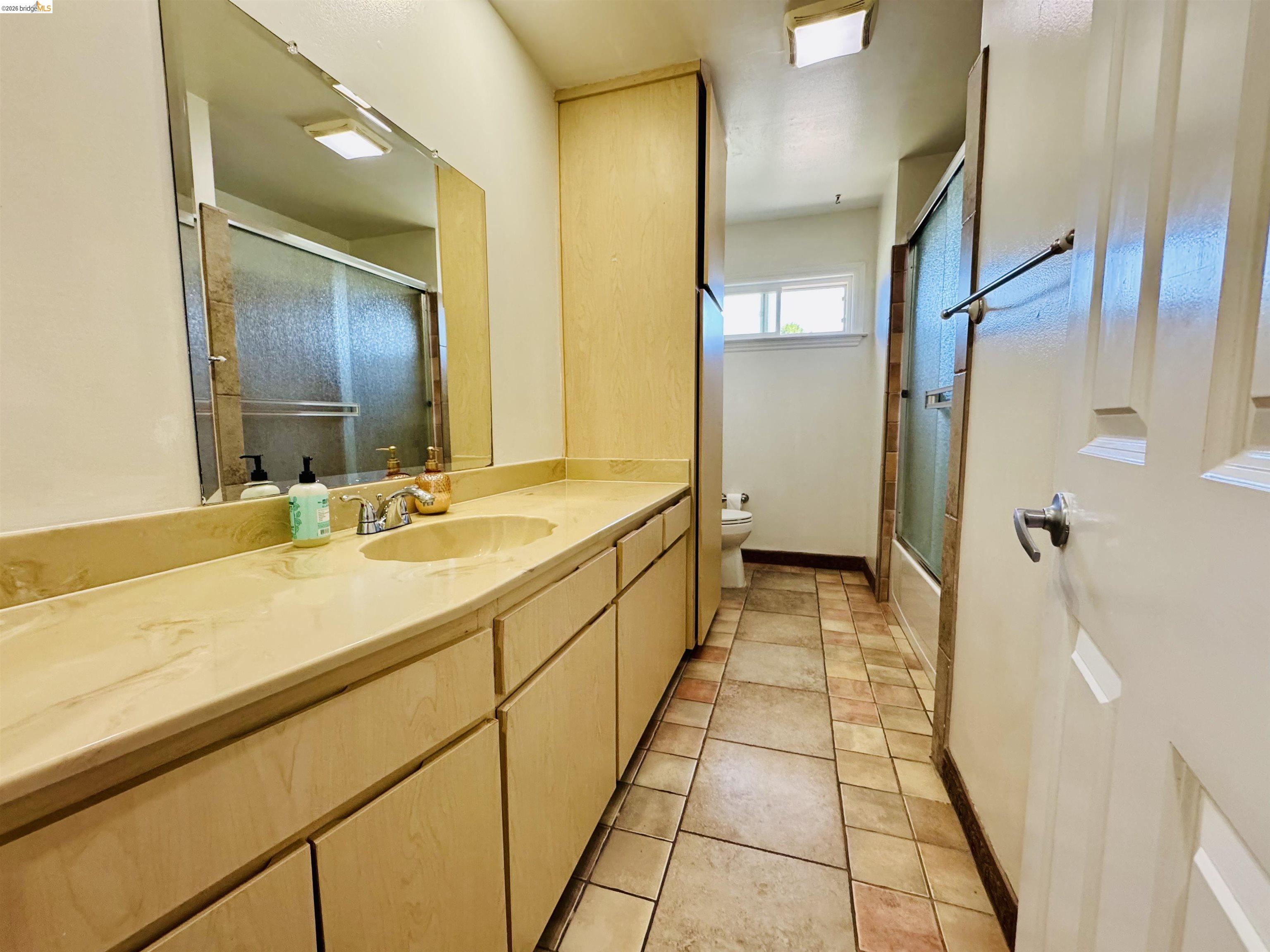 64 Washington Street Novato, CA 94947 - Photo 16 of 21 Extended vanity with integrated sink and chrome faucet