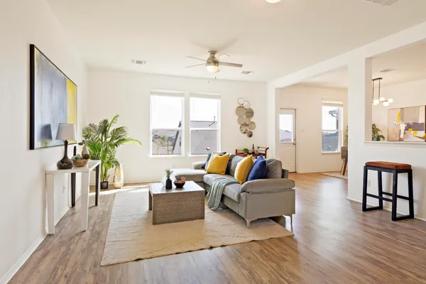 a living room with furniture and a large window