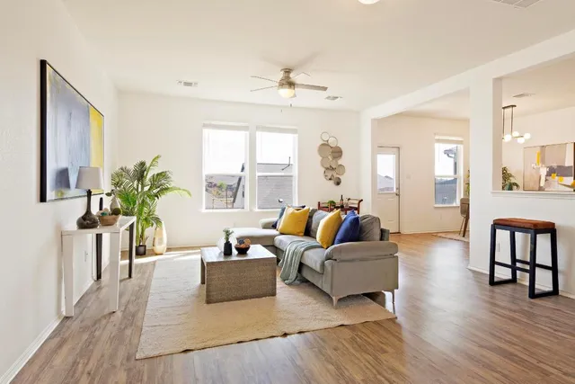 a living room with furniture and a large window