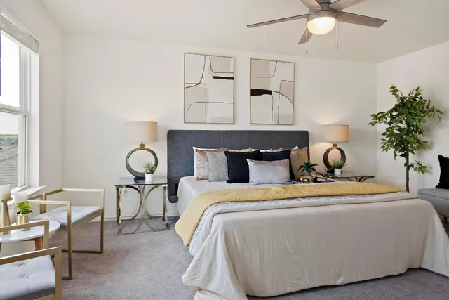 a bedroom with a bed and window