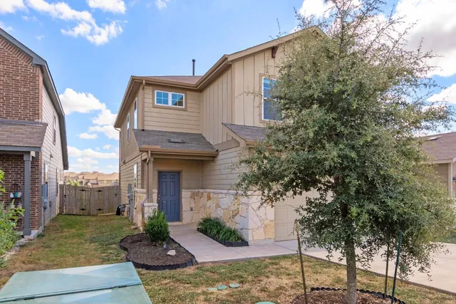 a front view of a house with a garage