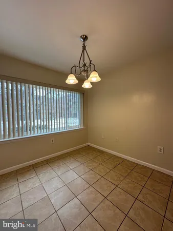 a view of a livingroom and window
