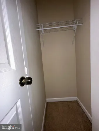 a view of an empty room and a windows