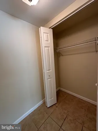 a view of a storage & utility room with a fireplace