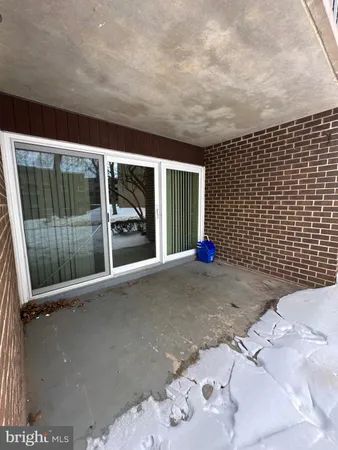 a view of yard covered with snow in front of house