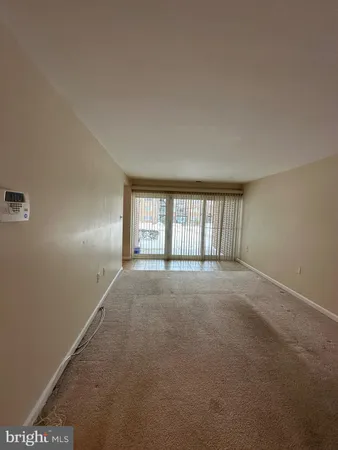 a view of empty room with windows