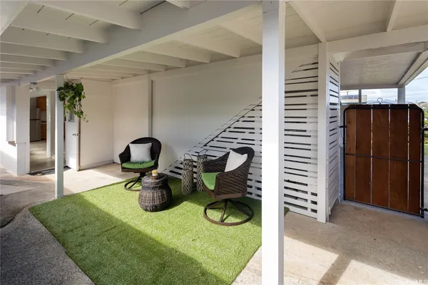 a view of swimming pool with seating area