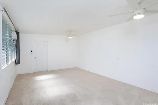 an empty room with a empty space and windows