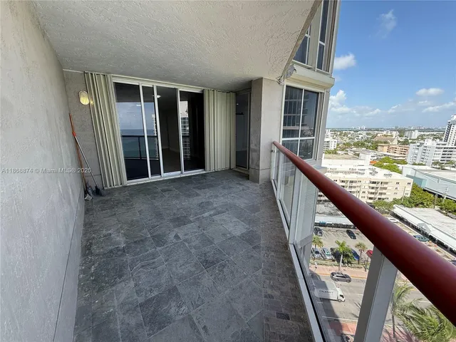 a view of balcony with furniture