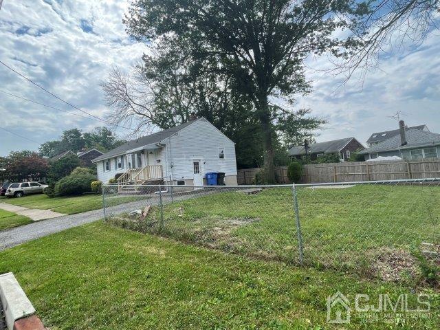 57 Corey Street Fords, NJ 08863 - Photo 16 of 18 a view of a house with backyard and sitting area