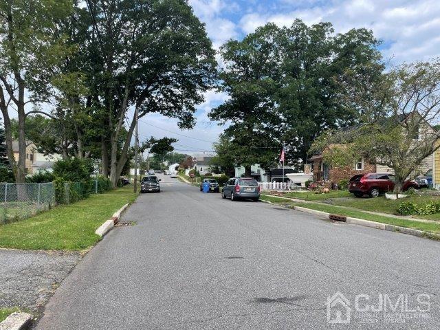 57 Corey Street Fords, NJ 08863 - Photo 17 of 18 a cars parked on the side of the road