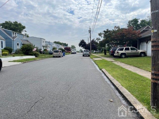 57 Corey Street Fords, NJ 08863 - Photo 18 of 18 a view of a street with a car parked on the side of the road