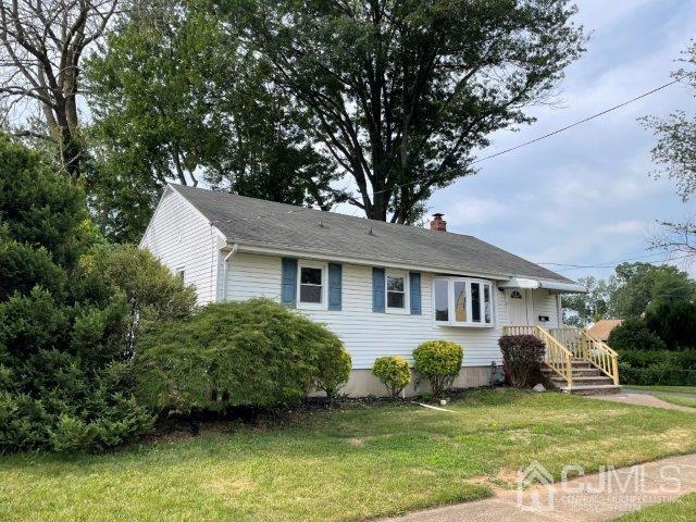 57 Corey Street Fords, NJ 08863 - Photo 2 of 18 a front view of a house with a yard