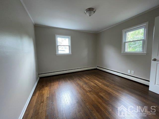 57 Corey Street Fords, NJ 08863 - Photo 6 of 18 an empty room with wooden floor and windows