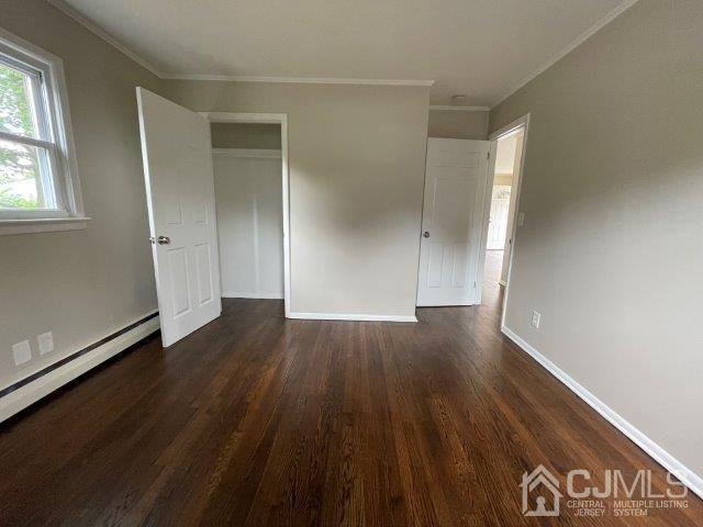 57 Corey Street Fords, NJ 08863 - Photo 7 of 18 an empty room with wooden floor and windows