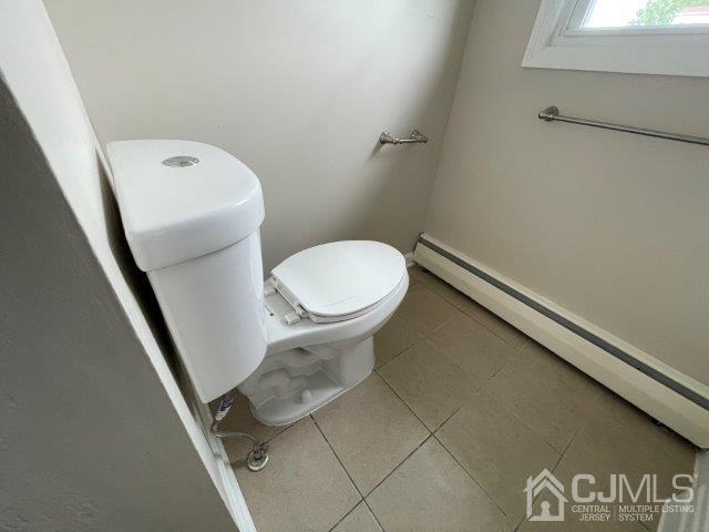57 Corey Street Fords, NJ 08863 - Photo 10 of 18 a white toilet sitting next to a bathroom