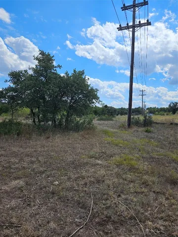 a view of a lake with houses in the back