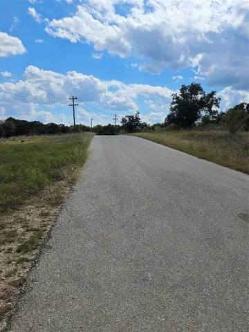 a view of a lake view with houses in the back