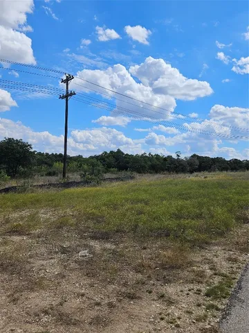 a view of a lake with houses in the back