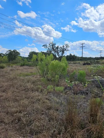 a view of a city with lush green forest