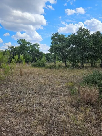 a view of a yard with an empty space