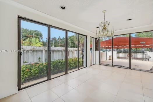 4144 Alton Road Miami Beach, FL 33140 - Photo 12 of 49 a view of big room with balcony and furniture
