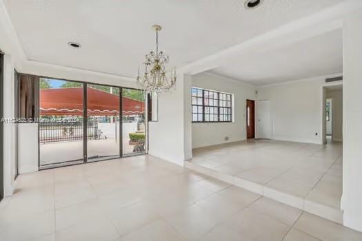 4144 Alton Road Miami Beach, FL 33140 - Photo 15 of 49 a view of an empty room with a window
