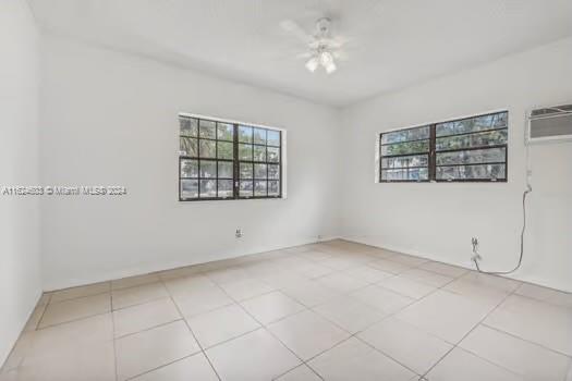 4144 Alton Road Miami Beach, FL 33140 - Photo 19 of 49 a view of an empty room with windows