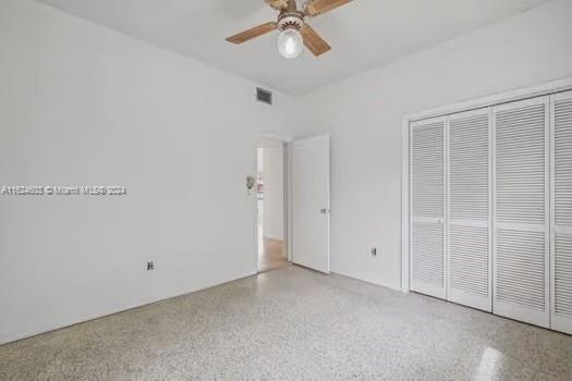 4144 Alton Road Miami Beach, FL 33140 - Photo 25 of 49 an empty room with a ceiling fan and a window