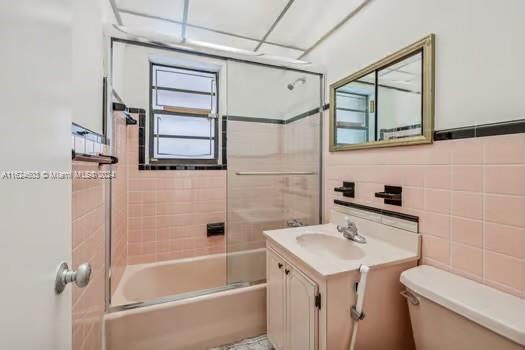 4144 Alton Road Miami Beach, FL 33140 - Photo 26 of 49 a bathroom with a sink toilet and shower