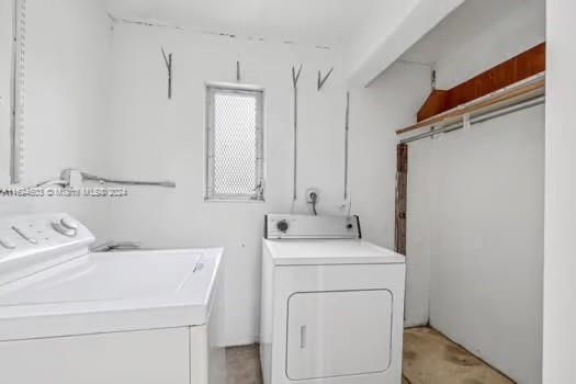 4144 Alton Road Miami Beach, FL 33140 - Photo 27 of 49 a view of bathroom with a washer and dryer