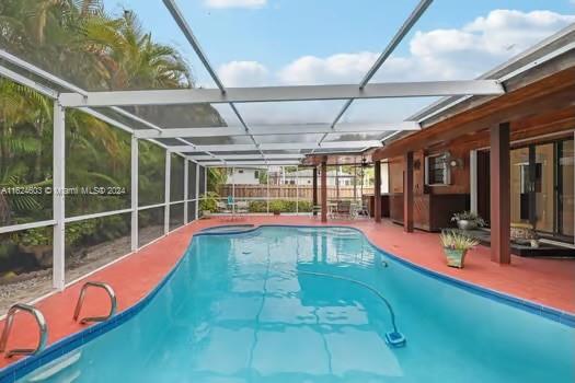 4144 Alton Road Miami Beach, FL 33140 - Photo 32 of 49 a view of swimming pool with a patio