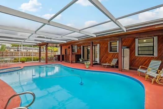 4144 Alton Road Miami Beach, FL 33140 - Photo 33 of 49 a view of swimming pool with seating area and furniture