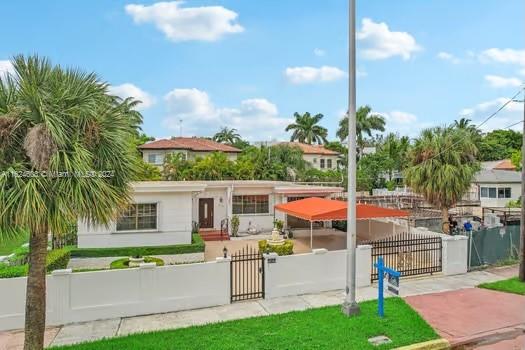 4144 Alton Road Miami Beach, FL 33140 - Photo 4 of 49 a view of an house with backyard and patio