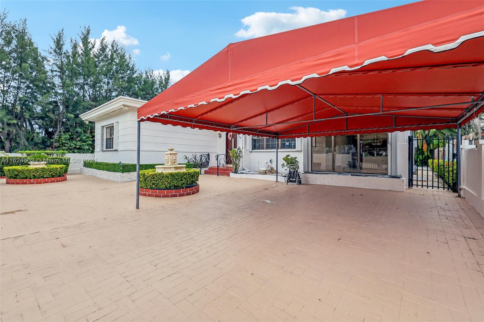 4144 Alton Road Miami Beach, FL 33140 - Photo 5 of 49 a view of a house with a yard