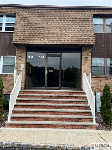 a view of a brick house with a large window