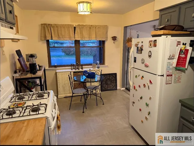 a view of a kitchen with appliances
