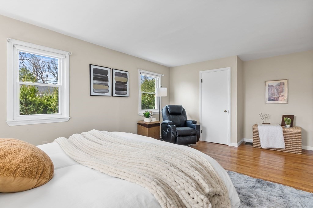 4 Claire Road Amesbury, MA 01913 - Photo 11 of 26 a bedroom with a bed and wooden floor