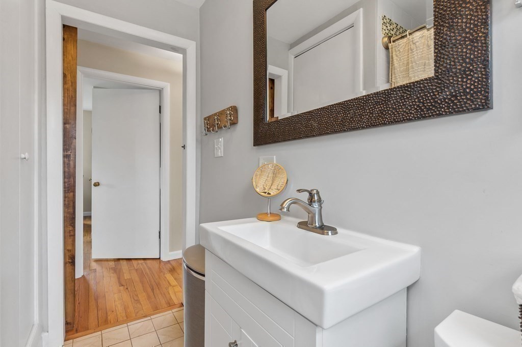 4 Claire Road Amesbury, MA 01913 - Photo 17 of 26 a bathroom with a sink and a mirror