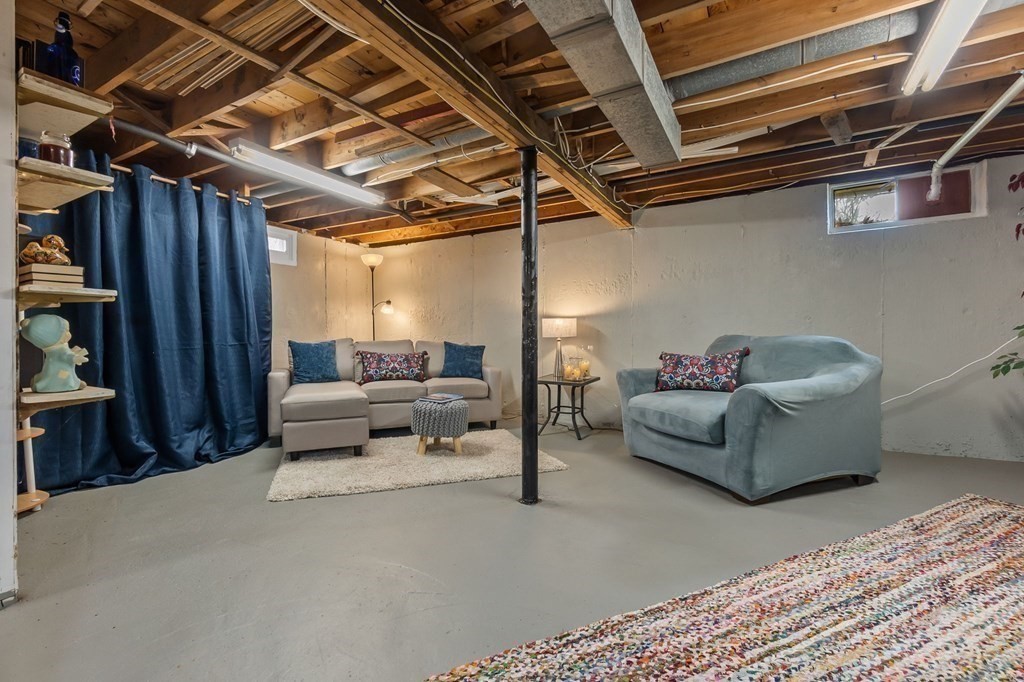 4 Claire Road Amesbury, MA 01913 - Photo 18 of 26 a living room with furniture and a window