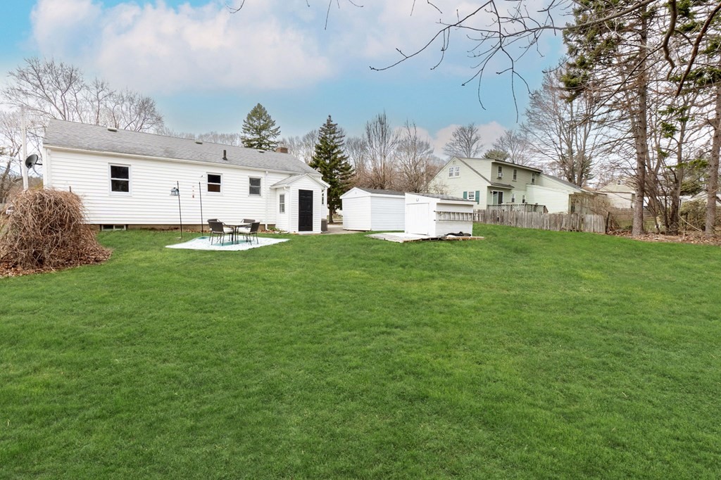 4 Claire Road Amesbury, MA 01913 - Photo 23 of 26 a front view of house with yard and trees
