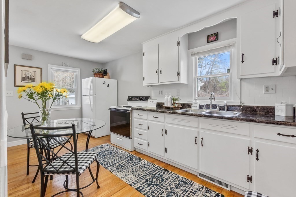 4 Claire Road Amesbury, MA 01913 - Photo 4 of 26 a kitchen with stainless steel appliances granite countertop a sink a stove a refrigerator and cabinets