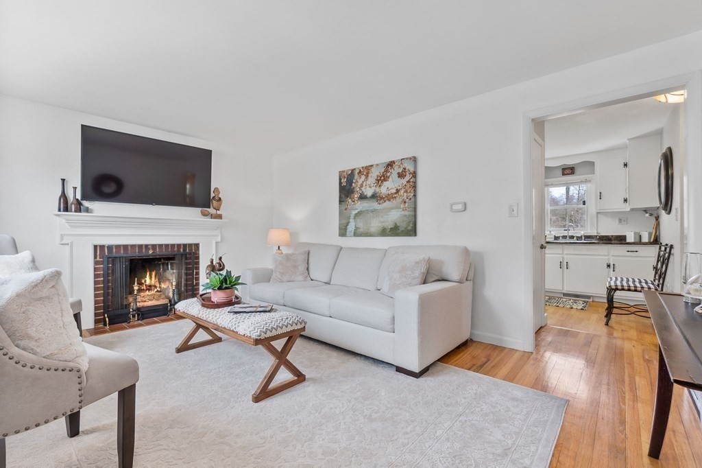 4 Claire Road Amesbury, MA 01913 - Photo 5 of 26 a living room with furniture and a fireplace