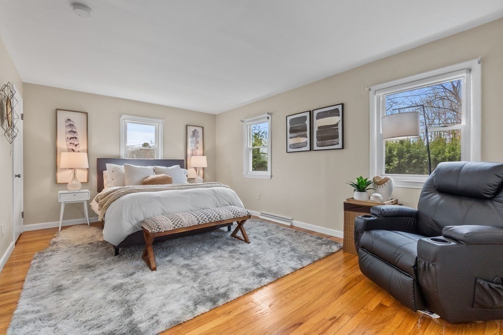 4 Claire Road Amesbury, MA 01913 - Photo 9 of 26 a bedroom with a bed couch and window